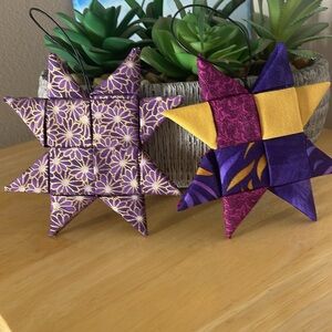 2 fabric folded star decorations